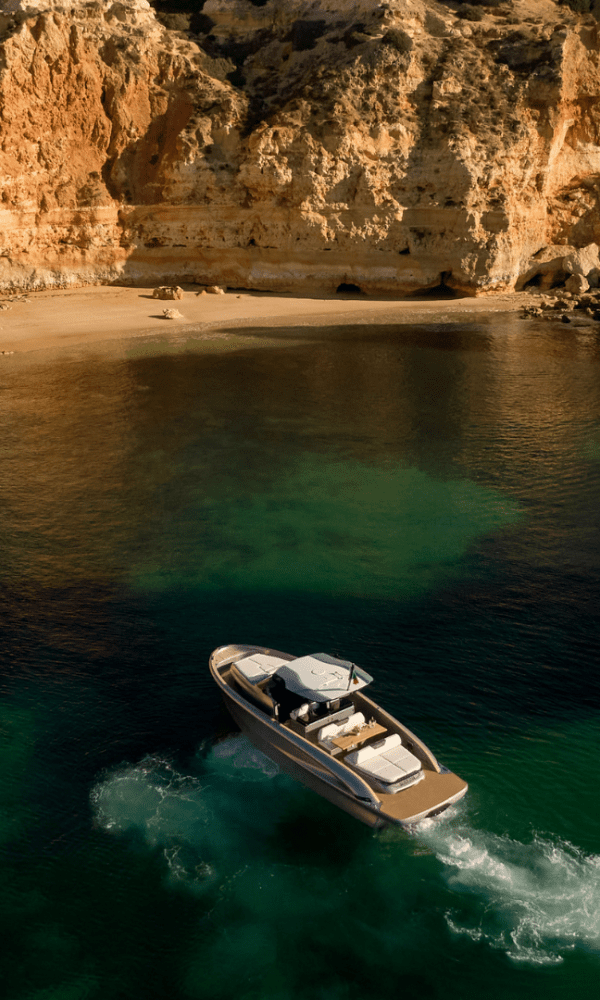 Experience the beauty of the Algarve coast with a scenic cruise in Portugal. Crystal-clear turquoise waters stretch to the horizon, bordered by dramatic cliffs and golden sandy beaches. Passengers aboard the cruise boat enjoy panoramic views of the stunning coastline, dotted with picturesque caves and rock formations. Explore the Algarve's natural wonders and indulge in the tranquility of the sea on this unforgettable journey.